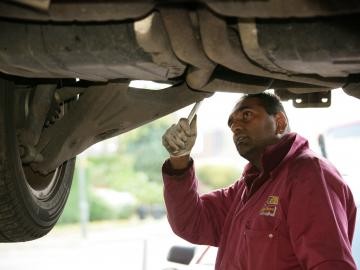 Man demonstrating car service process